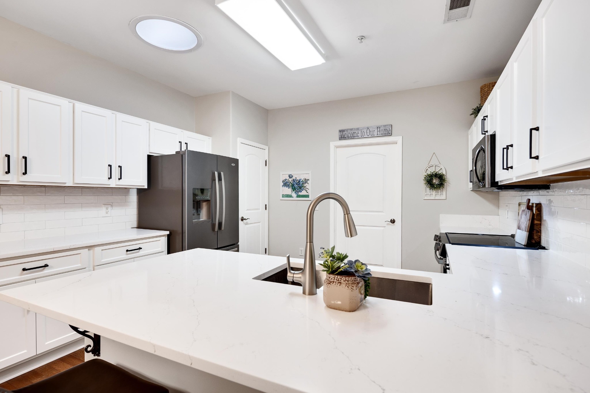 41 Peyton Ridge Drive, Unit 39 Collierville, TN 38017 - Photo 10 of 28 a kitchen with stainless steel appliances a sink a counter top space
