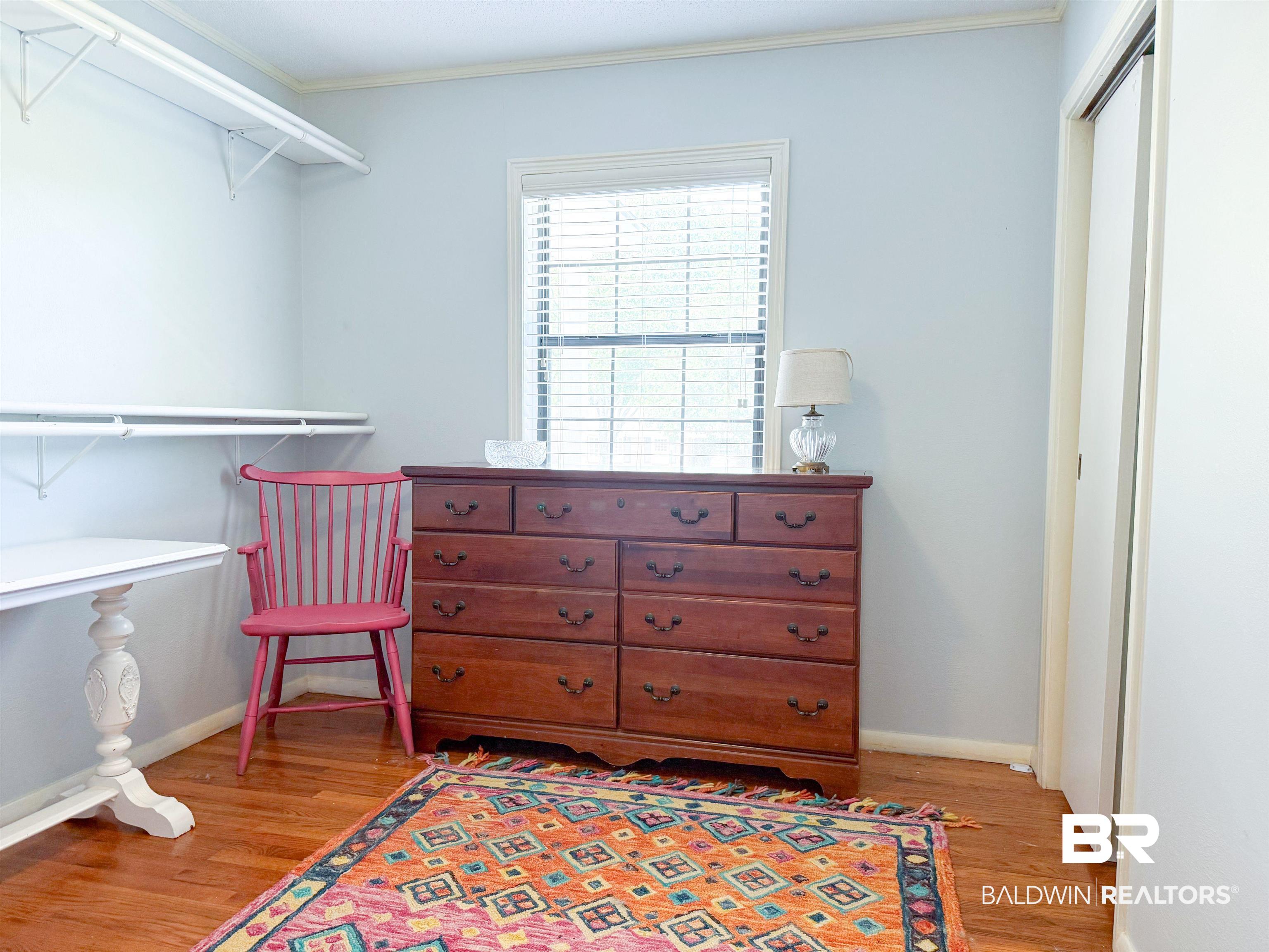 1508 Poplar Avenue Brewton, AL 36426 - Photo 15 of 22 Living area with ornamental molding and light wood-style flooring