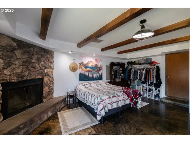 a bedroom with a bed and a tv