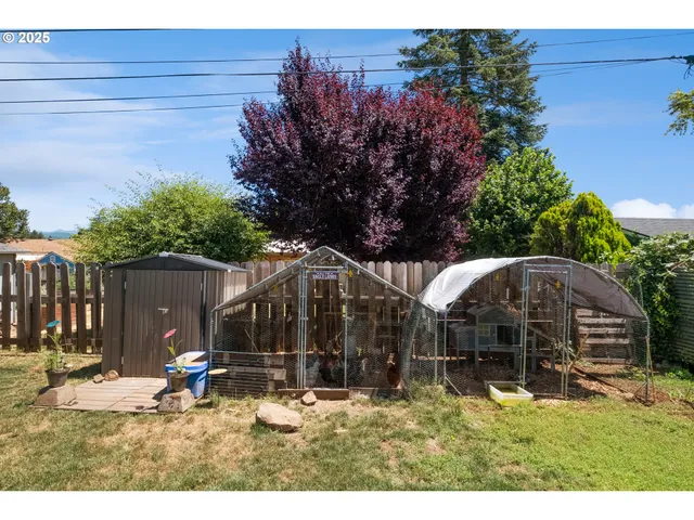 a backyard of a house with yard and outdoor seating