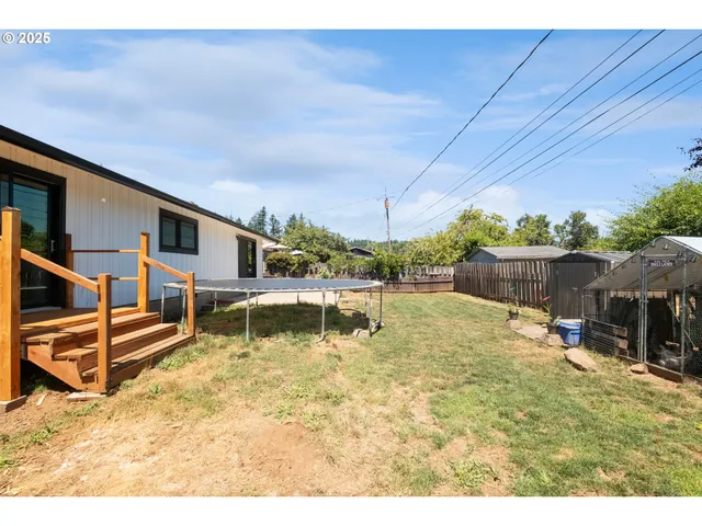 a swimming pool with outdoor seating and yard