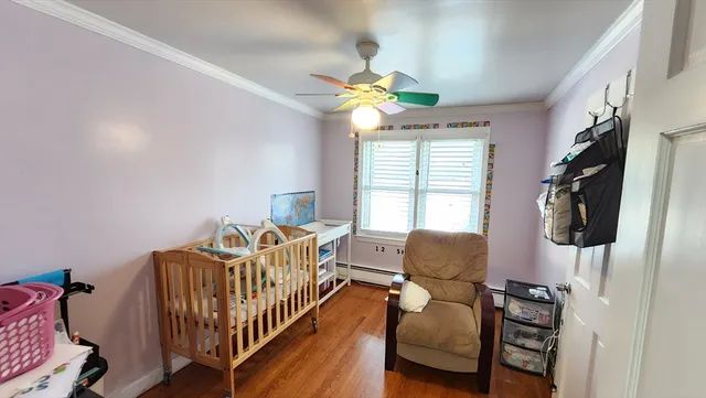 a bedroom with furniture and a window