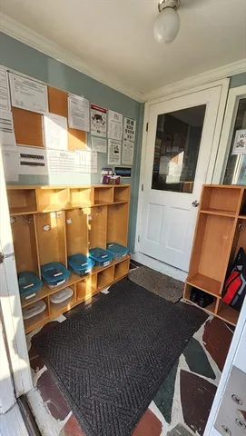 a room with wooden floor and furniture