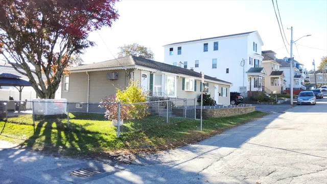 a view of a house with swimming pool and sitting area