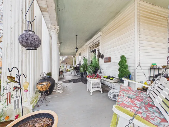 a view of a backyard with large trees