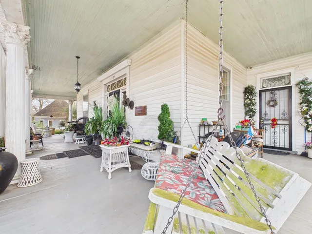 a view of a yard with a large tree