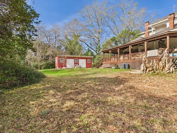 a view of a yard with trees