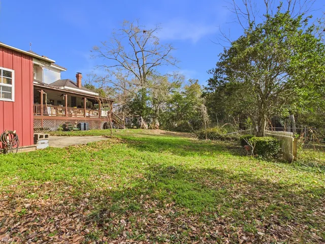 a very nice looking living room with furniture and a chandelier