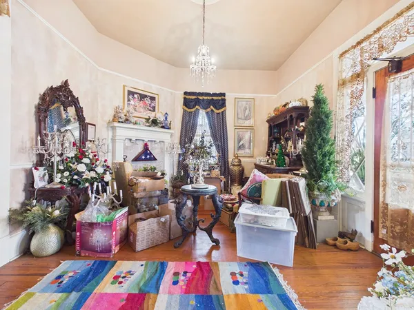 a living room with furniture a rug and a window