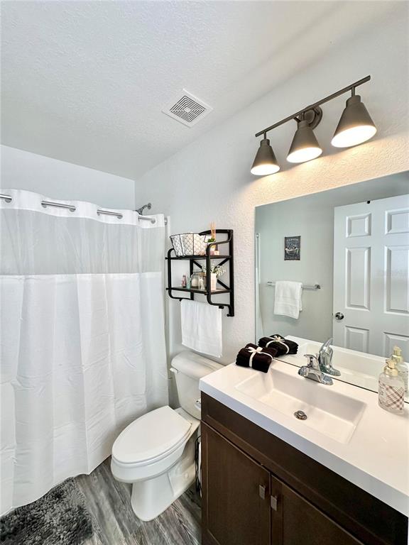 2120 Southwest 142nd Court Road Ocala, FL 34481 - Photo 11 of 14 a bathroom with a sink toilet and shower