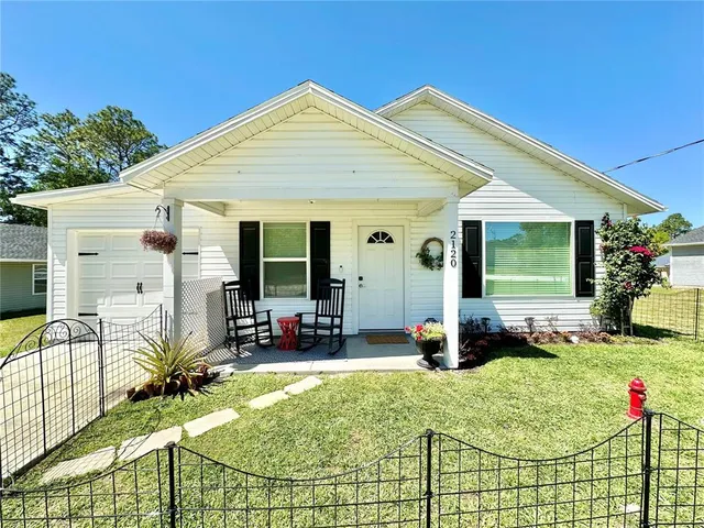 a view of house with patio outdoor seating