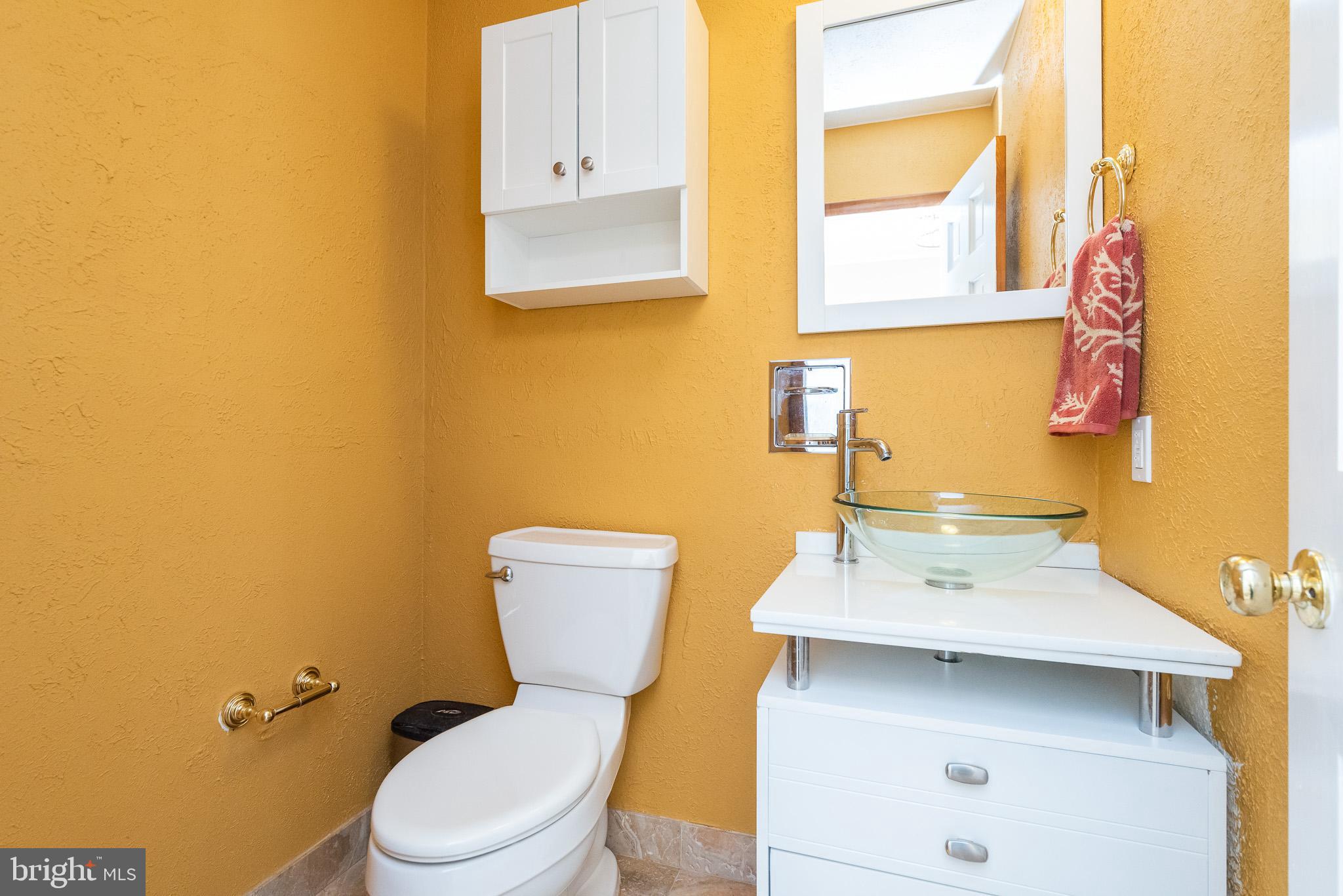 2703 Hunting Ridge Court Baldwin, MD 21013 - Photo 11 of 71 a bathroom with a sink mirror and toilet