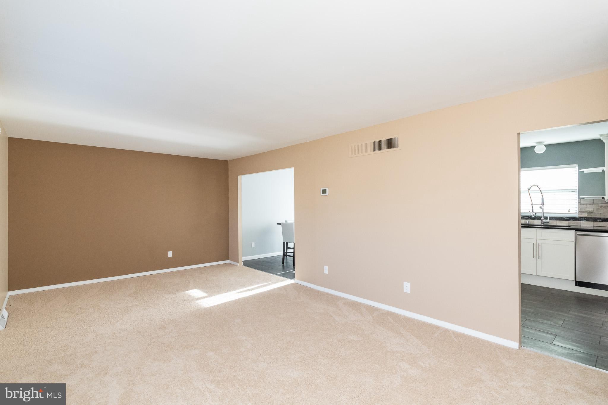 2703 Hunting Ridge Court Baldwin, MD 21013 - Photo 13 of 71 a view of an empty room with kitchen and a window