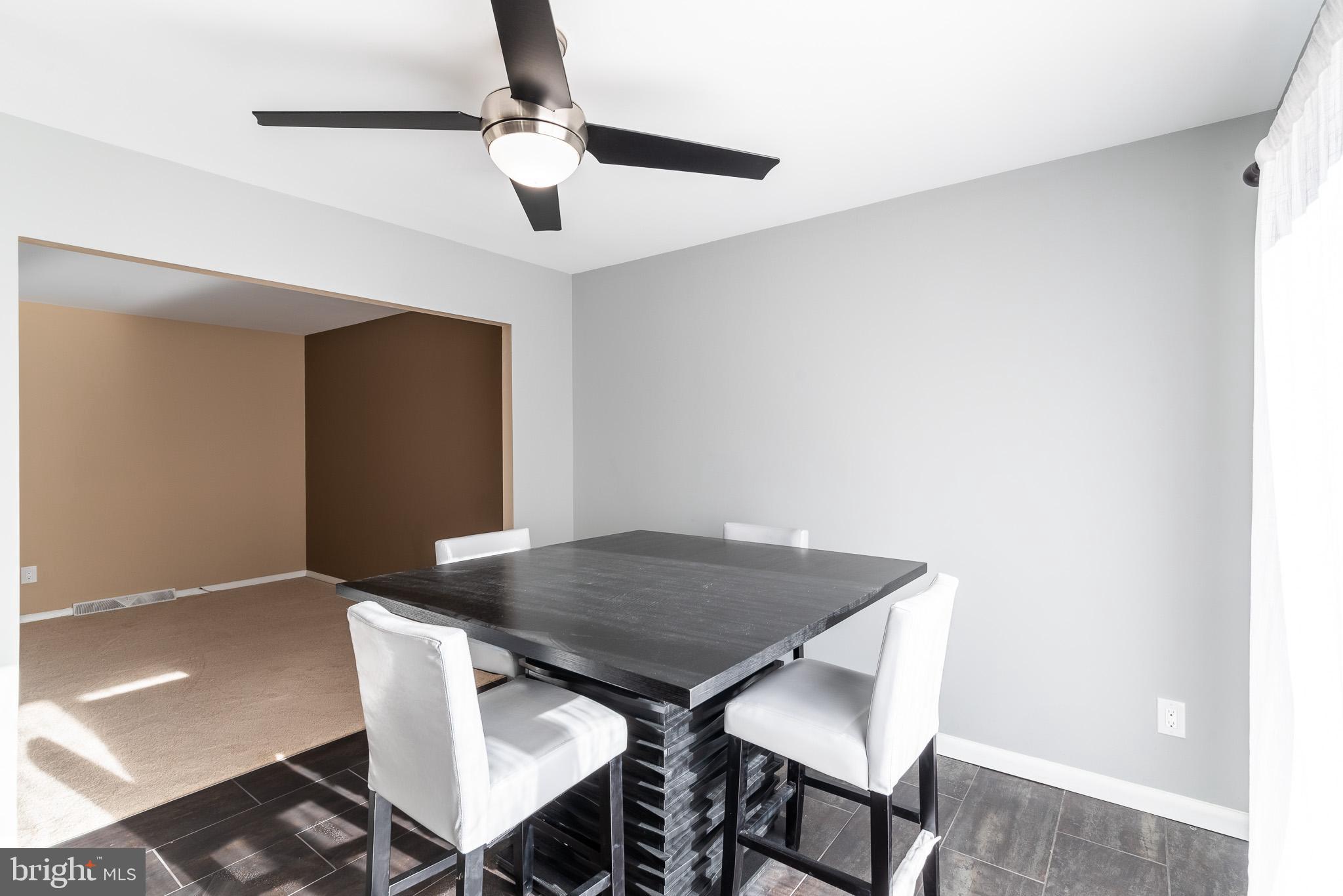 2703 Hunting Ridge Court Baldwin, MD 21013 - Photo 15 of 71 a view of a dining room with furniture and wooden floor