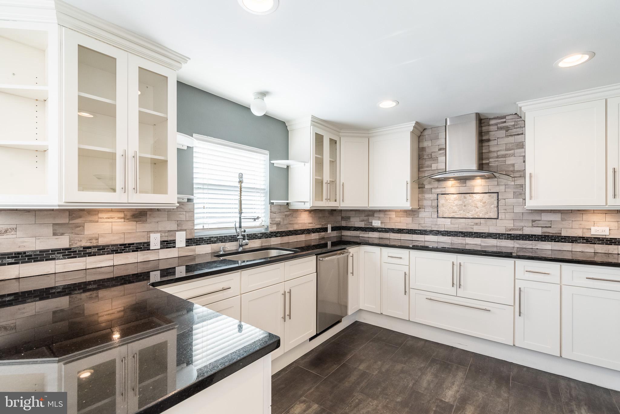 2703 Hunting Ridge Court Baldwin, MD 21013 - Photo 19 of 71 a kitchen with stainless steel appliances granite countertop a sink stove and cabinets