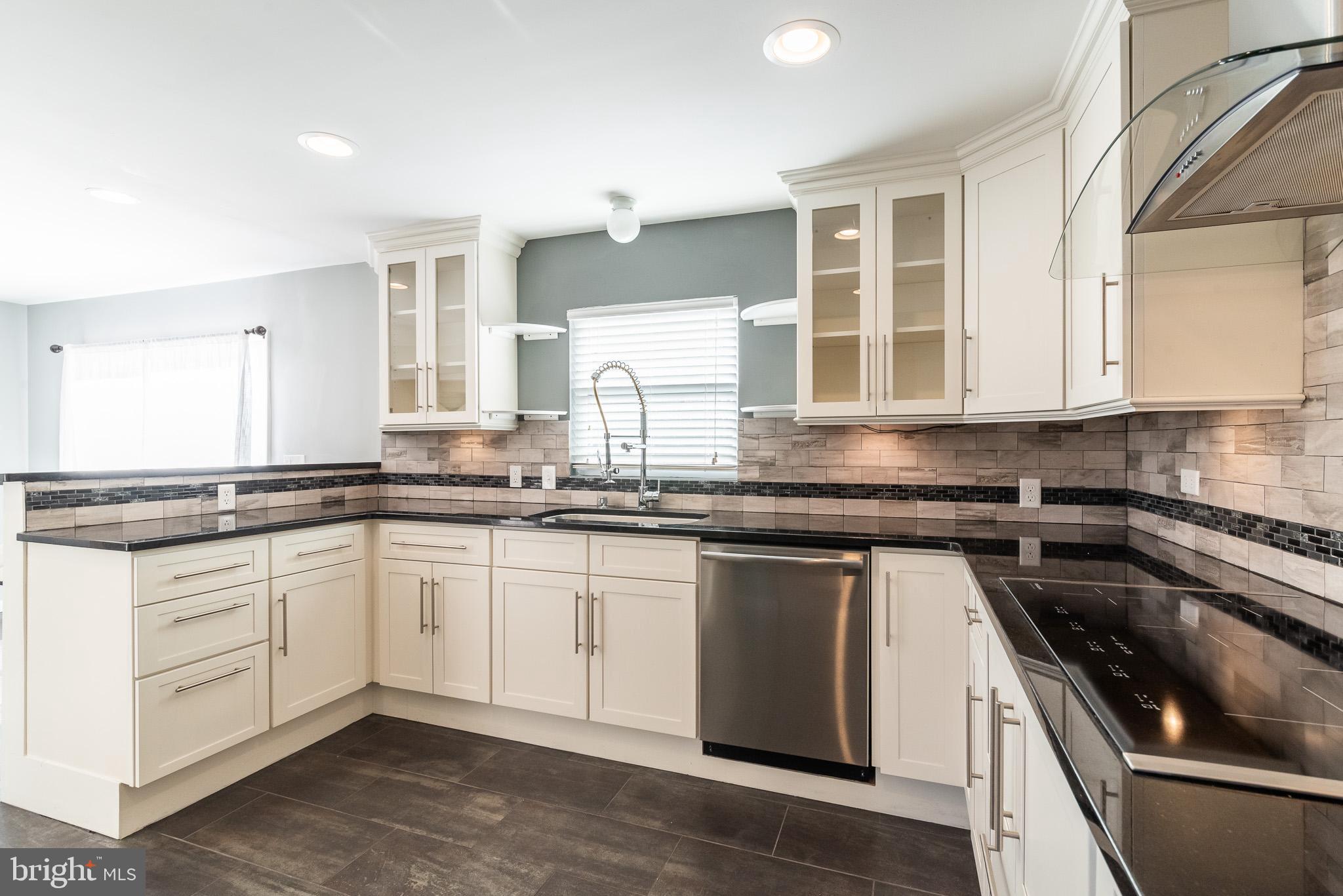2703 Hunting Ridge Court Baldwin, MD 21013 - Photo 21 of 71 a kitchen with granite countertop white cabinets and appliances