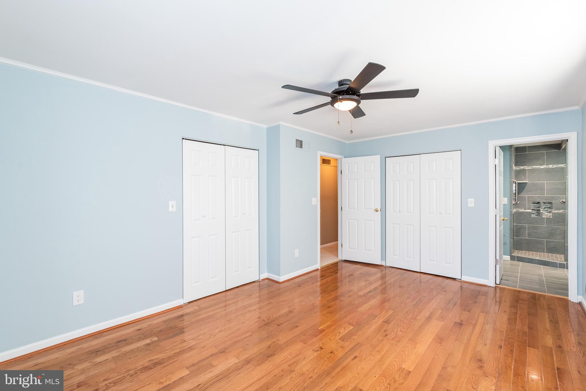 2703 Hunting Ridge Court Baldwin, MD 21013 - Photo 28 of 71 a view of a big room with wooden floor and windows in a room