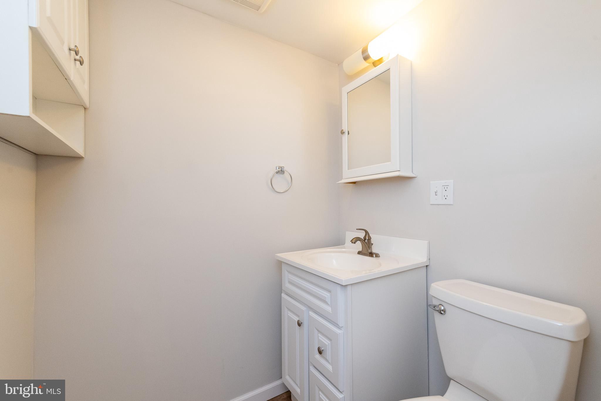 2703 Hunting Ridge Court Baldwin, MD 21013 - Photo 53 of 71 a bathroom with a sink toilet and mirror