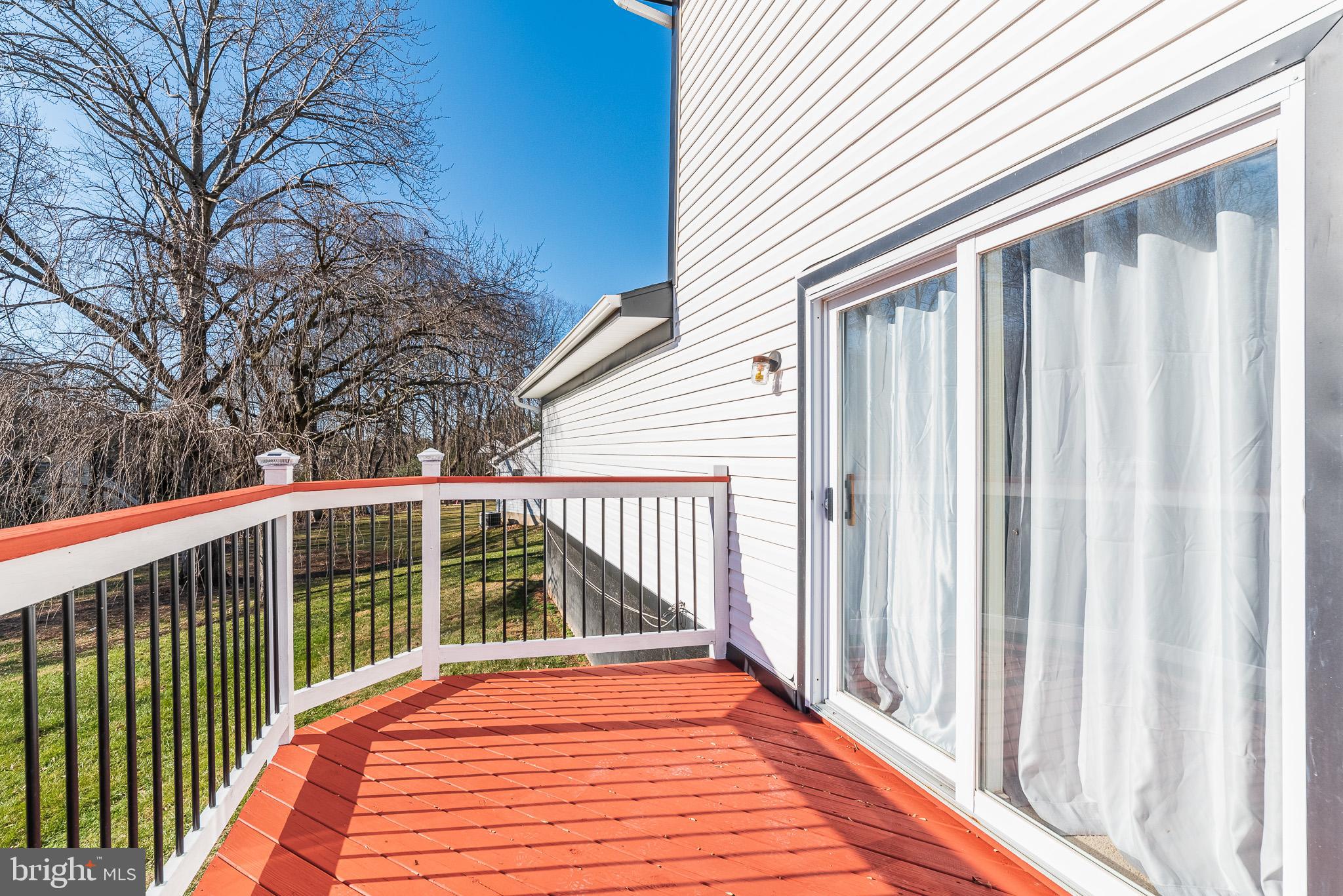 2703 Hunting Ridge Court Baldwin, MD 21013 - Photo 58 of 71 a view of a balcony with wooden floor and fence