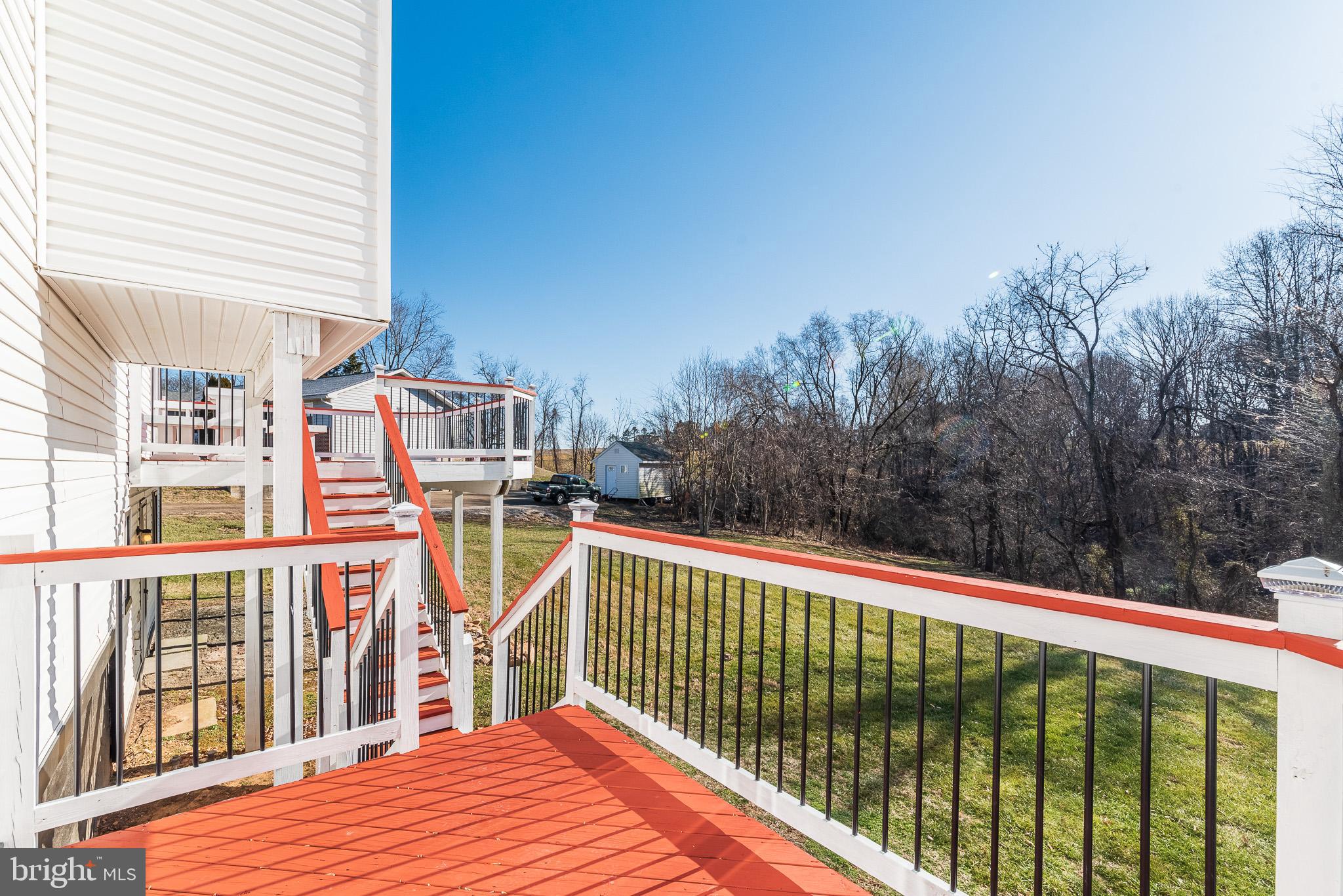 2703 Hunting Ridge Court Baldwin, MD 21013 - Photo 59 of 71 a view of a balcony with a floor to ceiling window and wooden fence