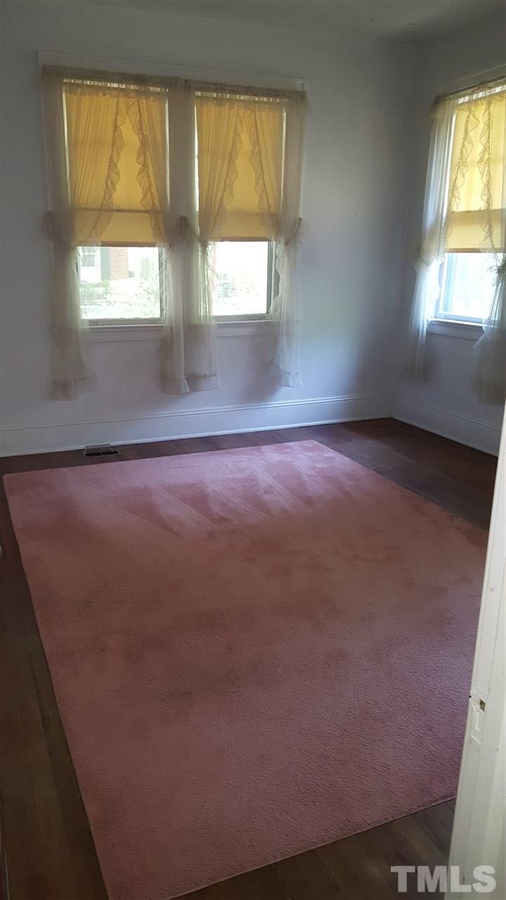 508 Burton Street Raleigh, NC 27608 - Photo 20 of 25 an empty room with windows