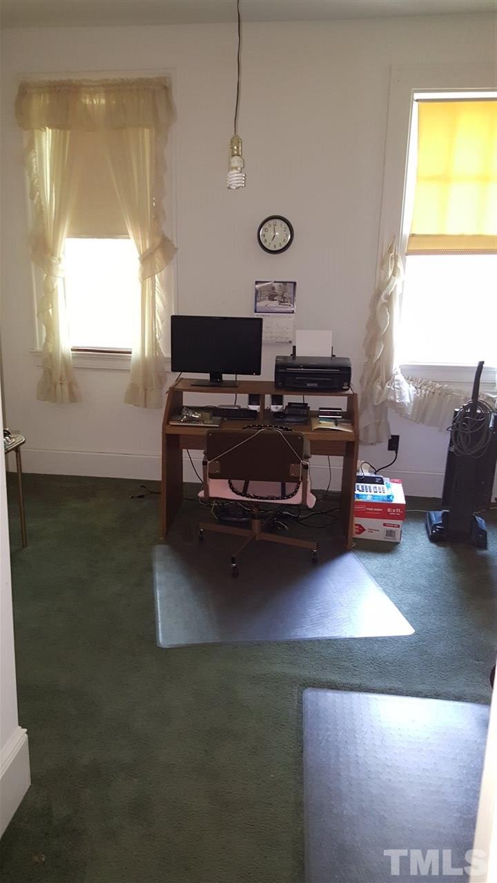 508 Burton Street Raleigh, NC 27608 - Photo 21 of 25 a living room with furniture and a window