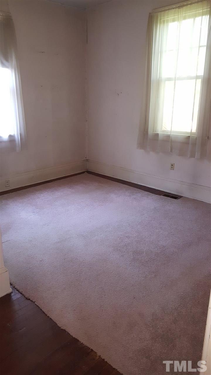 508 Burton Street Raleigh, NC 27608 - Photo 22 of 25 an empty room with a window