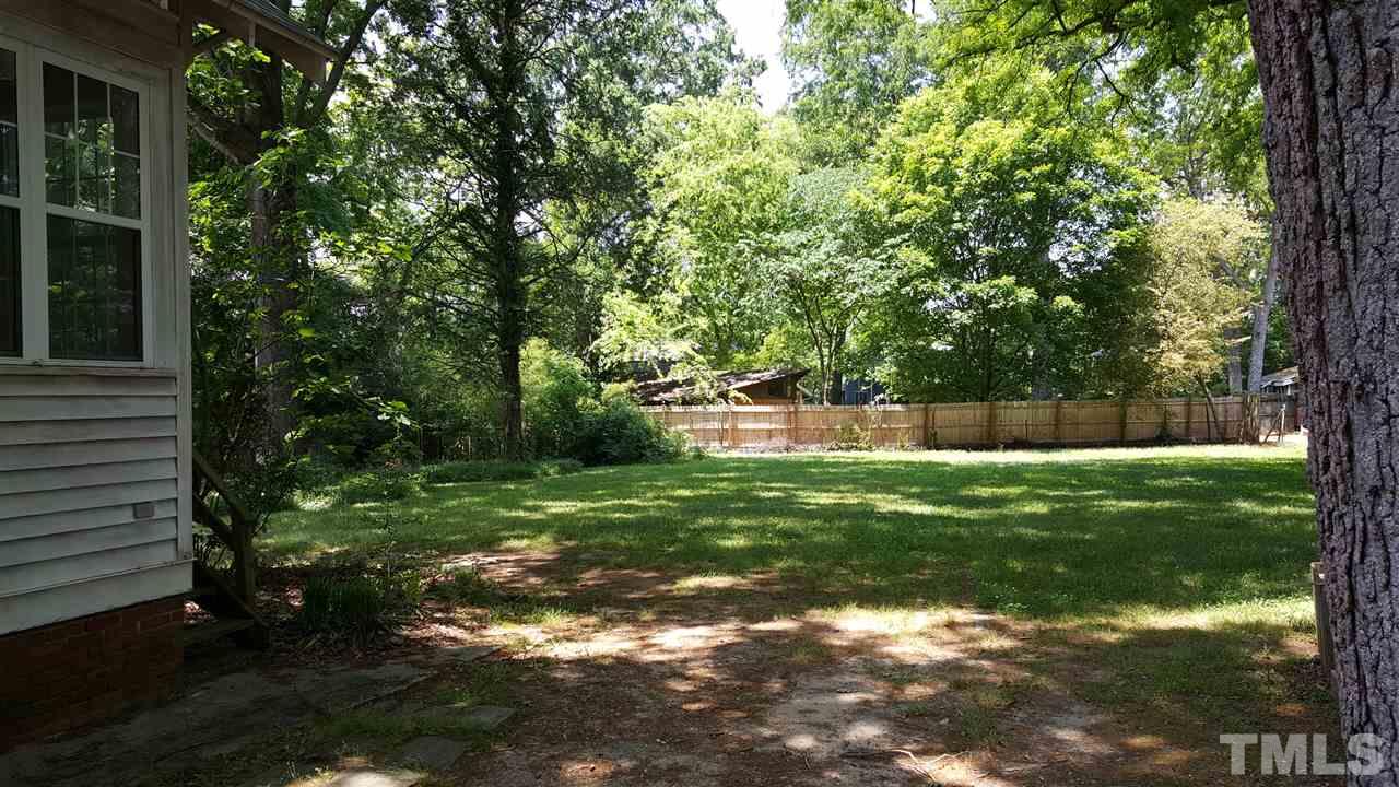 508 Burton Street Raleigh, NC 27608 - Photo 5 of 25 a view of a backyard with large trees