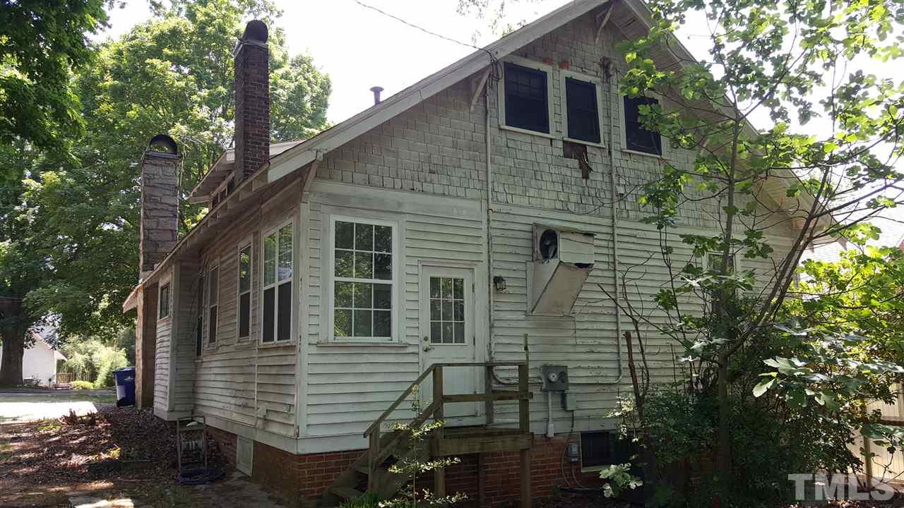 508 Burton Street Raleigh, NC 27608 - Photo 6 of 25 a front view of a house with a garden