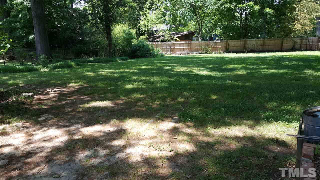 508 Burton Street Raleigh, NC 27608 - Photo 9 of 25 a backyard of a house with lots of green space