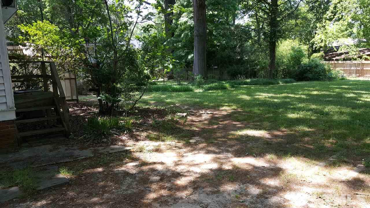 508 Burton Street Raleigh, NC 27608 - Photo 10 of 25 a backyard of a house with lots of green space