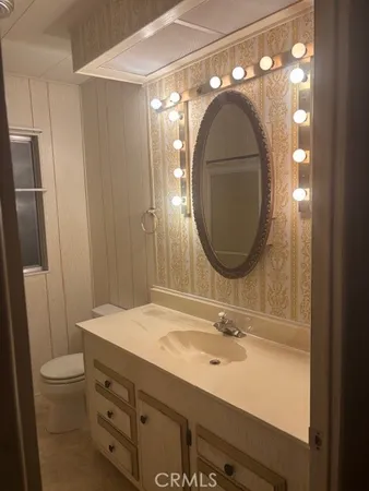 a bathroom with a sink and mirror