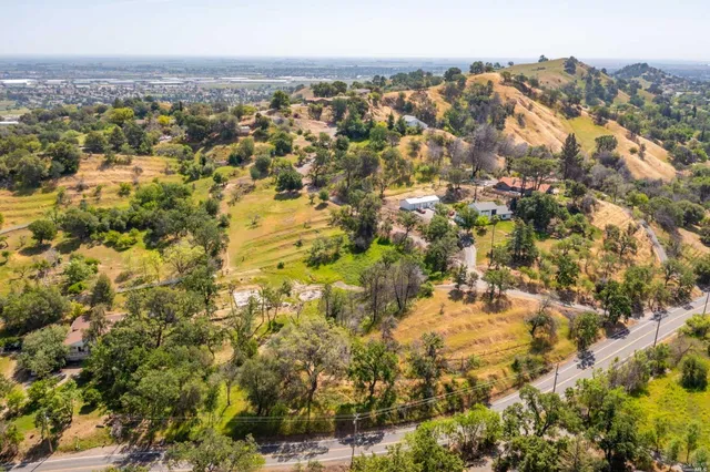 an aerial view of residential houses with outdoor space