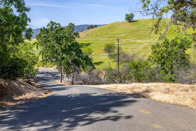 a view of lake background with wooden fence