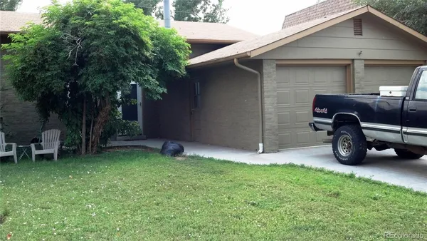 a view of a backyard with a car parked