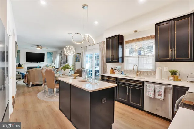 a large kitchen with a sink and cabinets