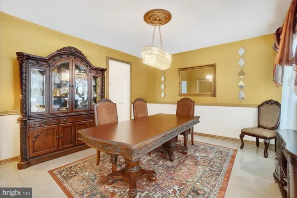a view of living room with furniture and a mirror
