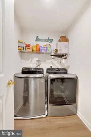 a utility room with washer and dryer