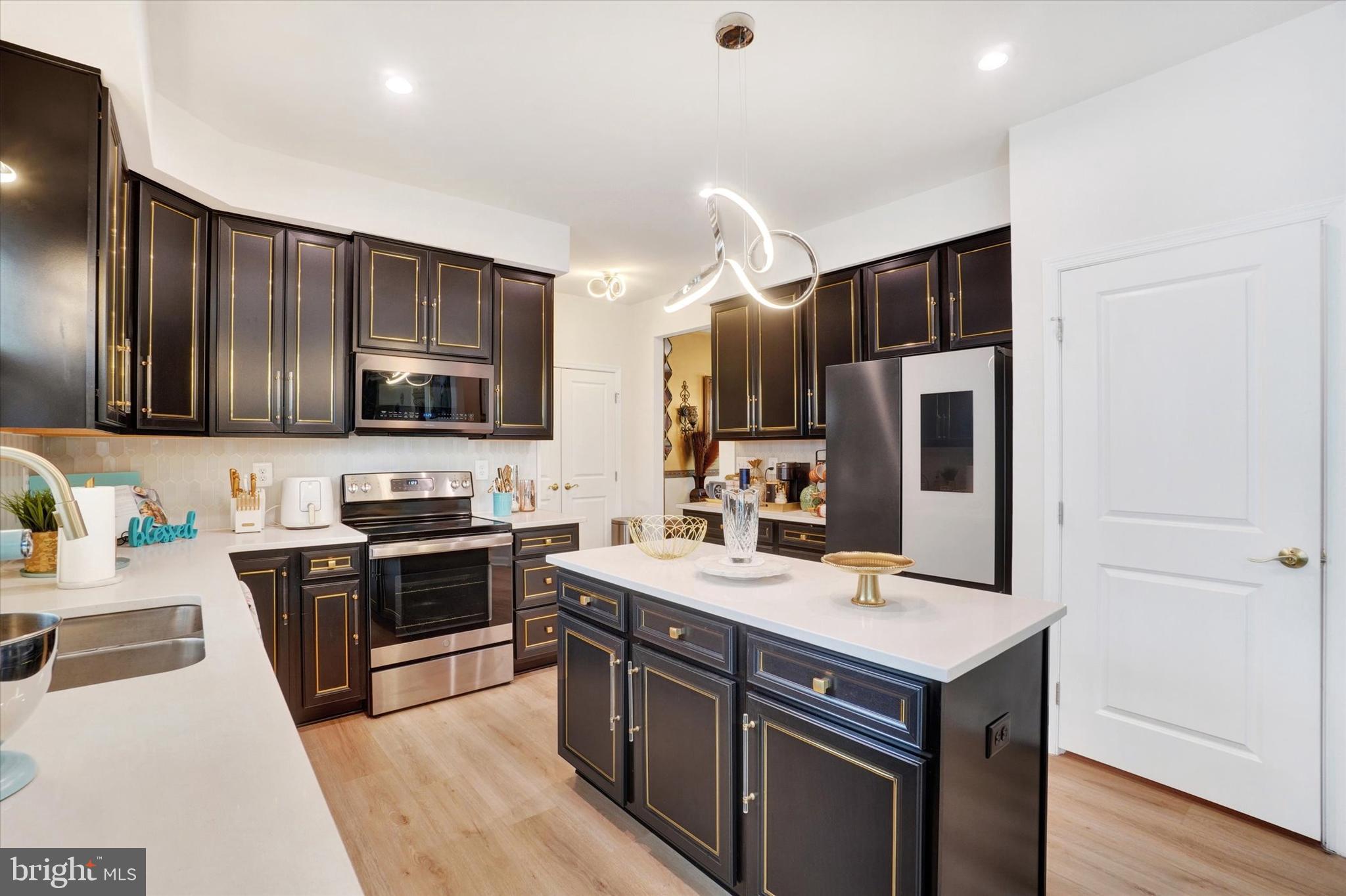 568 Monocacy Trail Spring Grove, PA 17362 - Photo 2 of 48 a kitchen with stainless steel appliances a sink stove refrigerator and cabinets