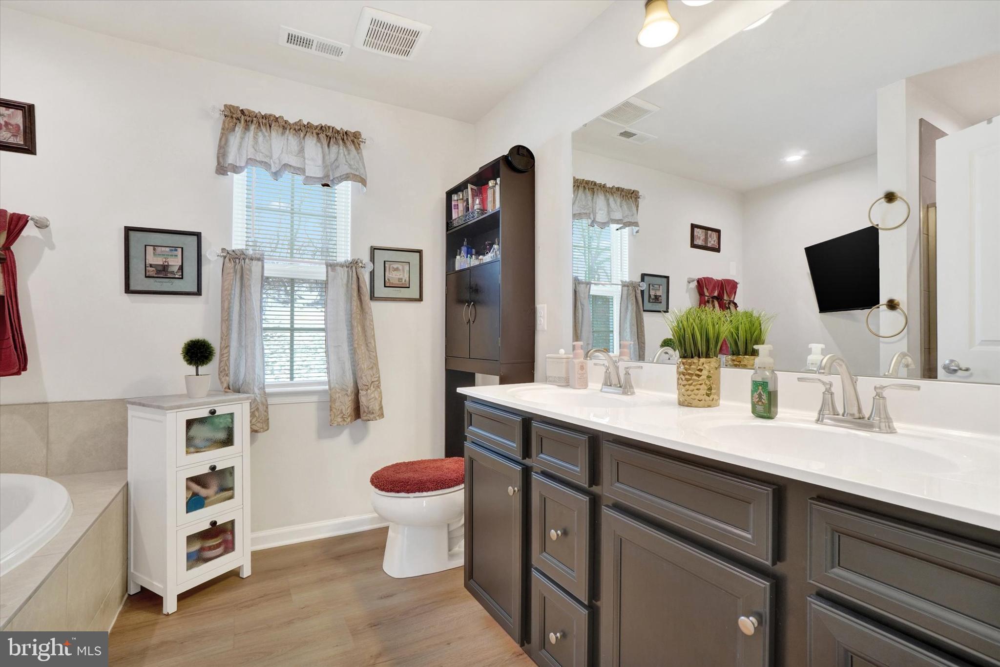 568 Monocacy Trail Spring Grove, PA 17362 - Photo 26 of 52 a spacious bathroom with a double vanity sink mirror and toilet