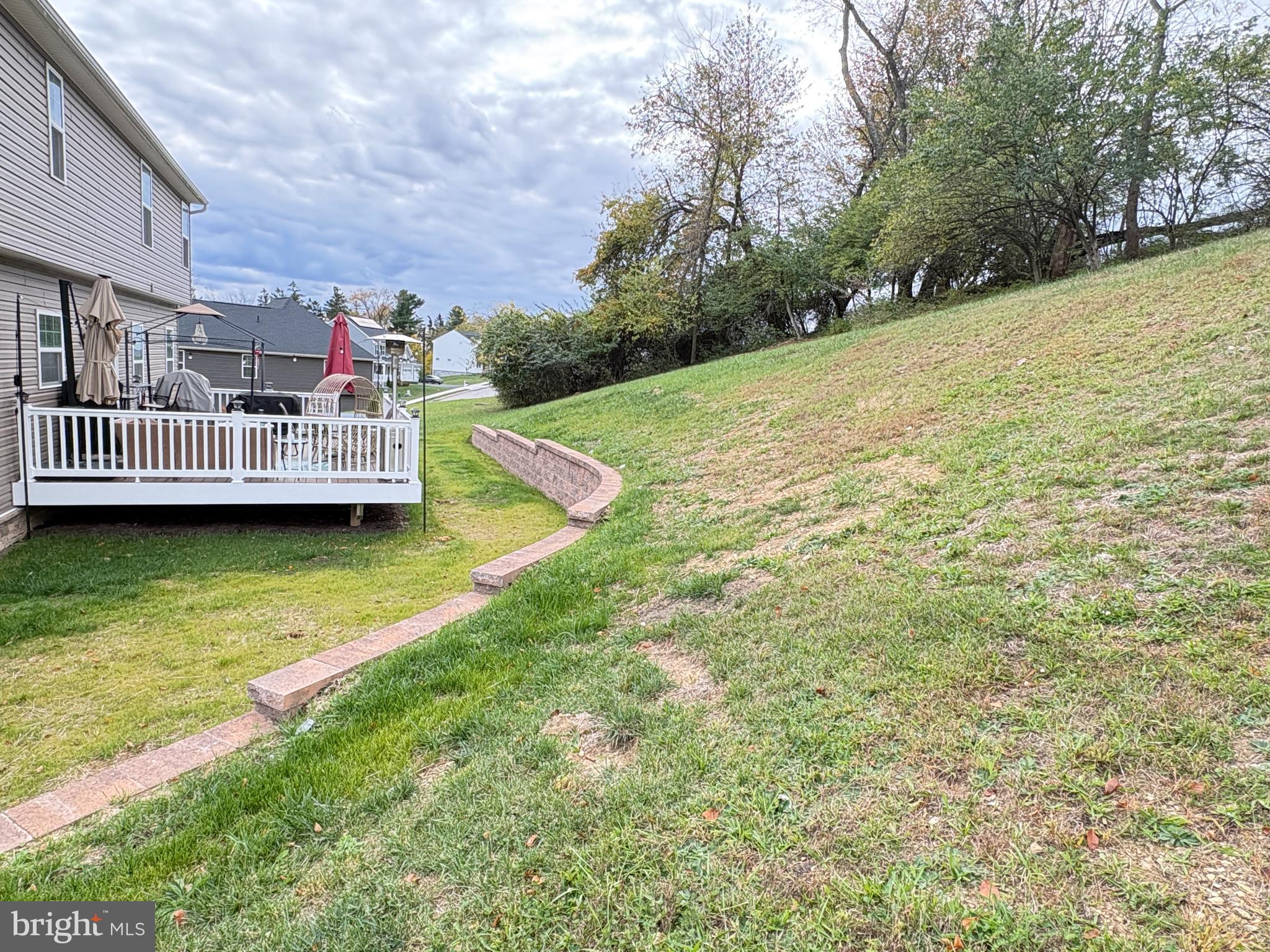 568 Monocacy Trail Spring Grove, PA 17362 - Photo 34 of 48 a view of a house with a wooden deck and a yard