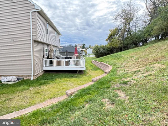 a view of a yard with swimming pool and outdoor space