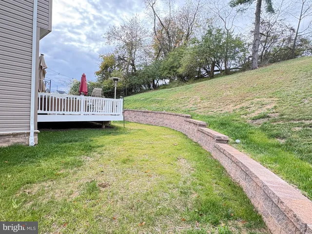 a view of a deck with wooden floor and outdoor seating
