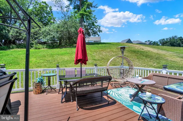 a view of a backyard with sitting area