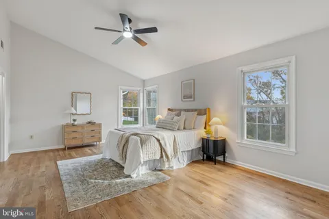 a bedroom with furniture and a window