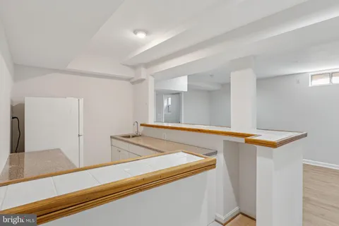 a view of a kitchen cabinets and a sink