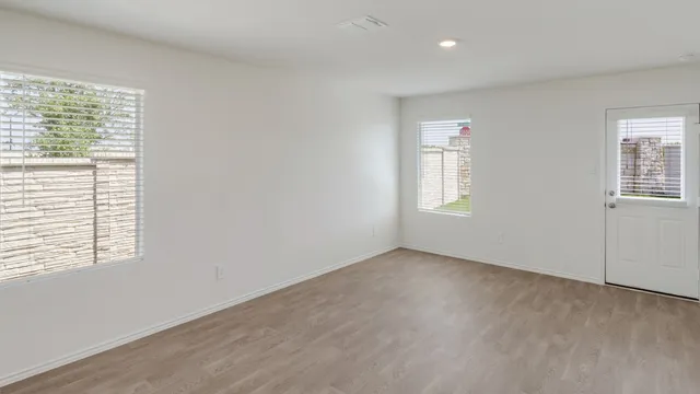 an empty room with windows