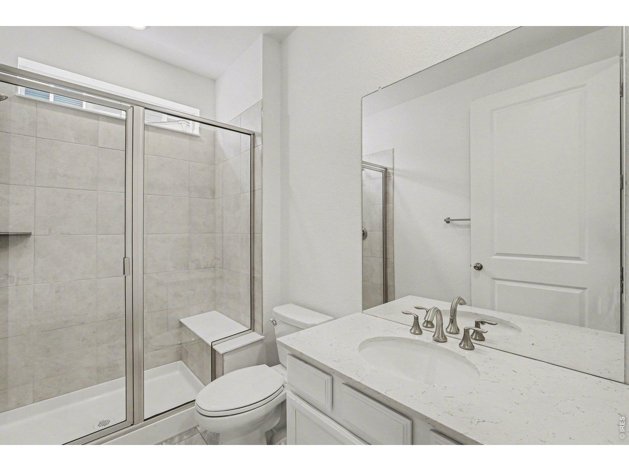 5258 Inland Avenue Firestone, CO 80504 - Photo 20 of 44 NEXTGen Studio Bathroom w/ Walk-In Shower
