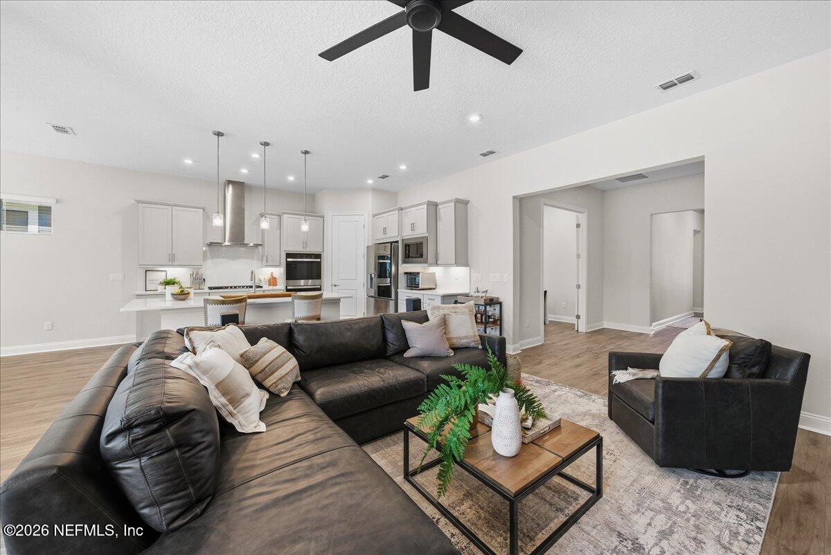 80 Ridgehill Way St. Johns, FL 32259 - Photo 11 of 60 a living room with furniture and kitchen view