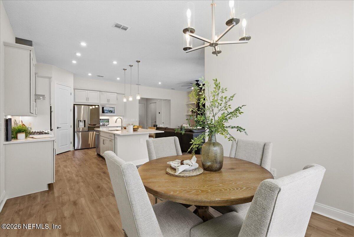80 Ridgehill Way St. Johns, FL 32259 - Photo 20 of 60 a view of a dining room with furniture and a table